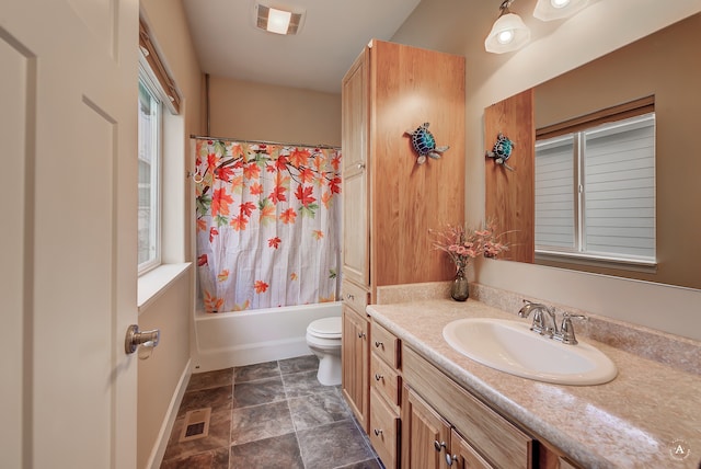 full bathroom featuring vanity, toilet, and shower / tub combo