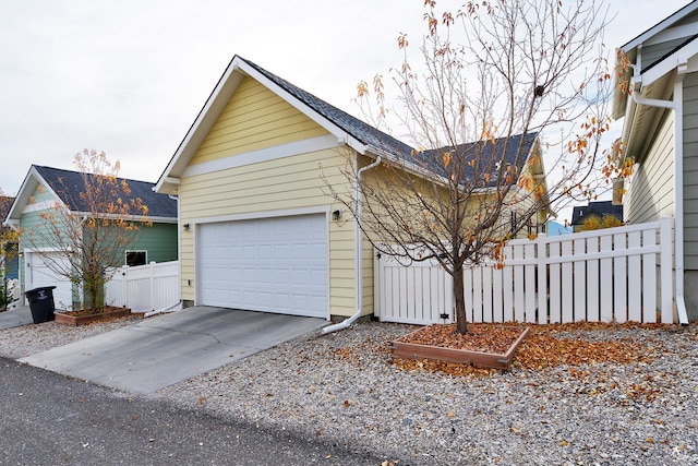 view of side of property with a garage