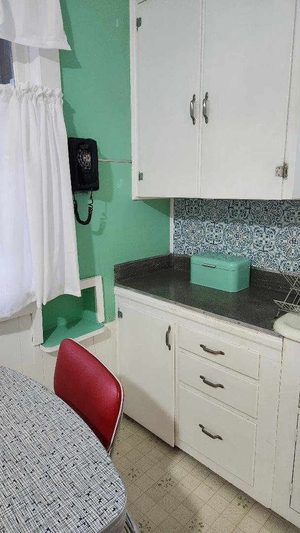 kitchen featuring white cabinets and decorative backsplash