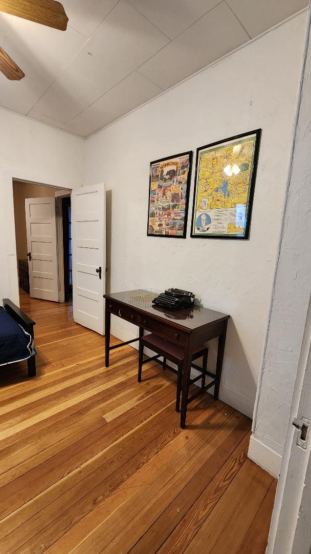 hallway featuring wood-type flooring