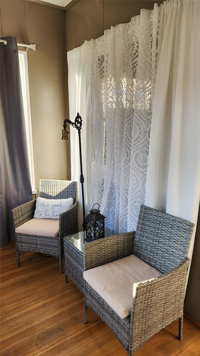 sitting room featuring hardwood / wood-style flooring