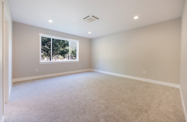 unfurnished room with light colored carpet