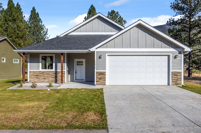 craftsman-style house featuring a front yard and a garage