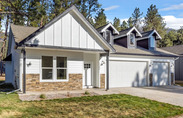 view of front facade with a front yard and a garage