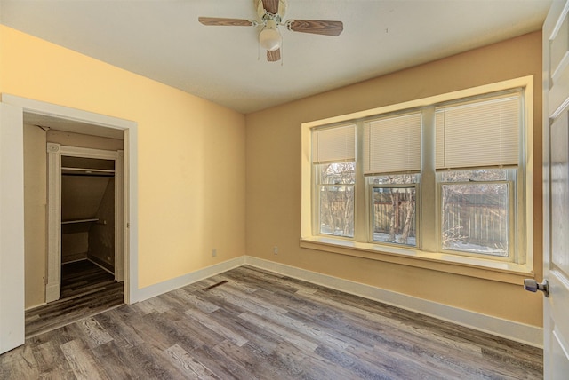 420 Knight St, Helena, MT 59601 - unfurnished bedroom featuring wood finished floors, baseboards, and a ceiling fan