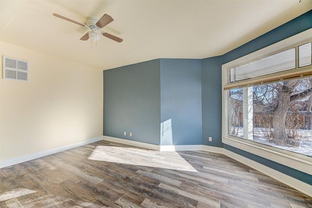 unfurnished room featuring ceiling fan and wood-type flooring