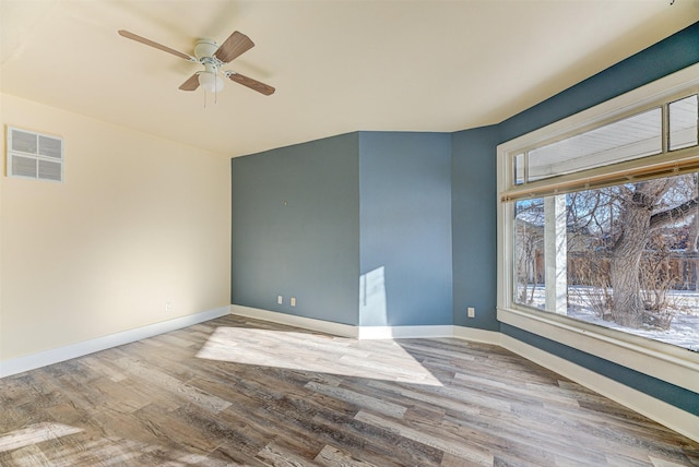 420 Knight St, Helena, MT 59601 - unfurnished room featuring a ceiling fan, wood finished floors, and baseboards
