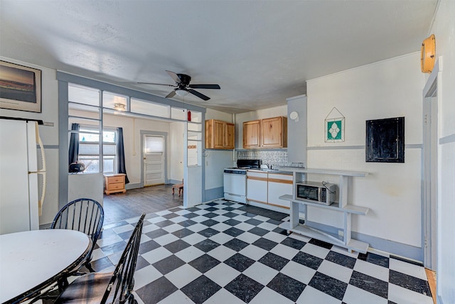 420 Knight St, Helena, MT 59601 - kitchen featuring tile patterned floors, white appliances, a ceiling fan, light countertops, and decorative backsplash