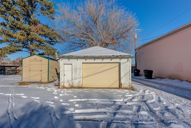 420 Knight St, Helena, MT 59601 - snow covered garage featuring a garage and a shed