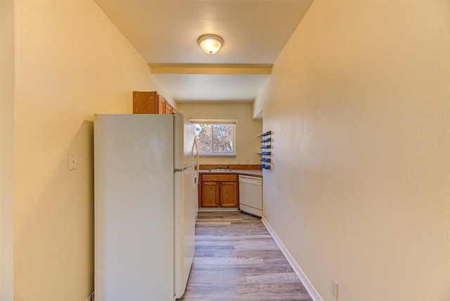 420 Knight St, Helena, MT 59601 - hall featuring light wood-style floors, a sink, and baseboards