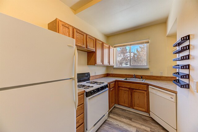 420 Knight St, Helena, MT 59601 - kitchen featuring white appliances, a sink, light wood-style flooring, brown cabinetry, and open shelves