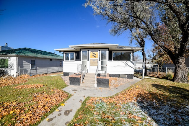 view of front of property with a sunroom