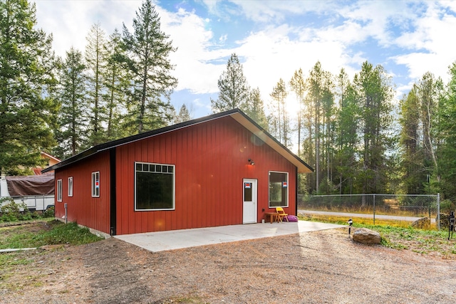 view of property exterior with a patio