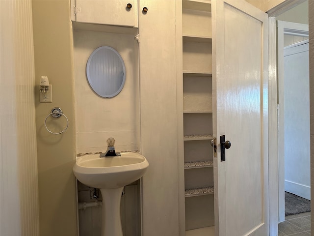 bathroom with tile patterned floors