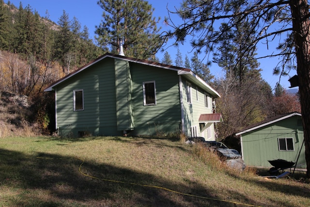 view of home's exterior featuring a lawn