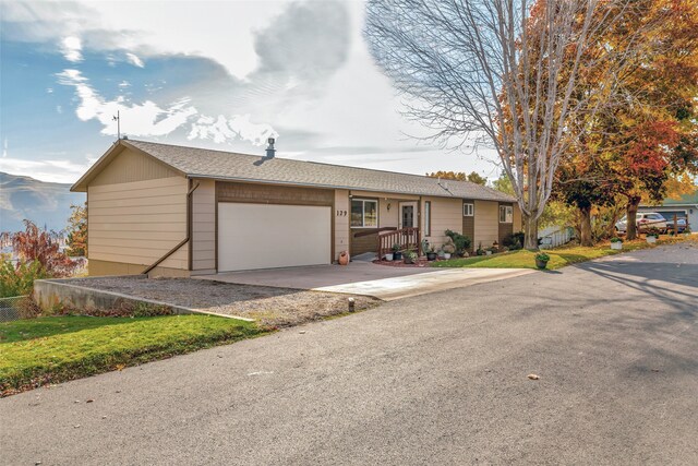 single story home featuring a garage