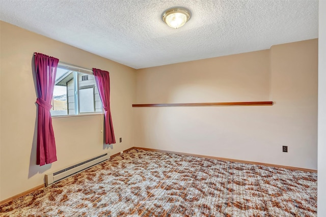 unfurnished room with a textured ceiling, a baseboard heating unit, baseboards, and carpet
