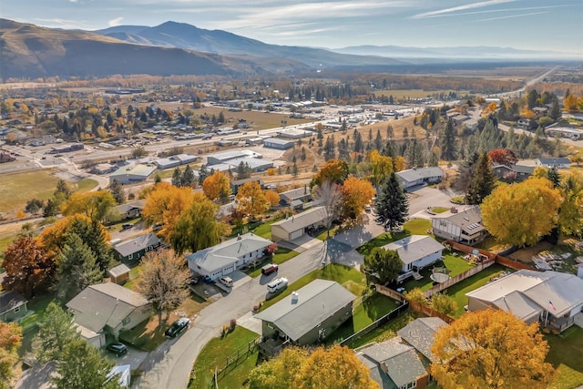 drone / aerial view featuring a residential view and a mountain view