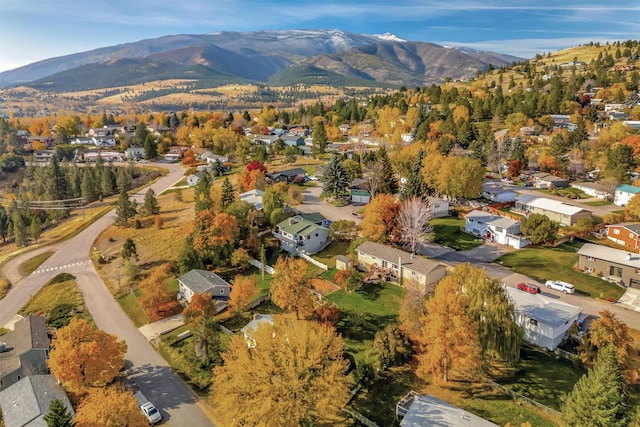 drone / aerial view featuring a residential view and a mountain view