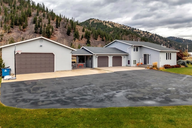 view of front of home featuring a mountain view and a garage