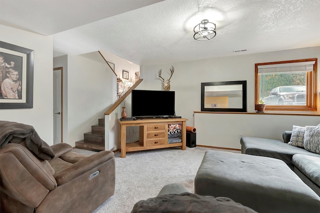 living room with carpet and a textured ceiling