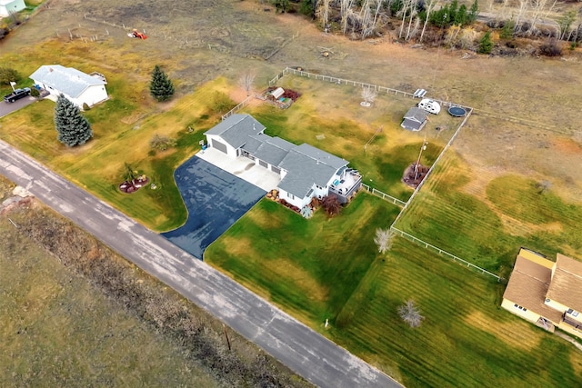 birds eye view of property with a rural view