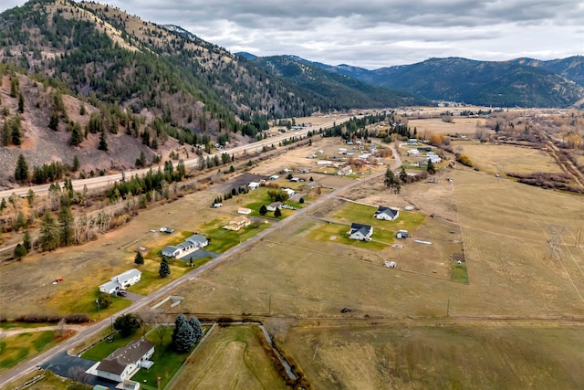 birds eye view of property with a mountain view and a rural view