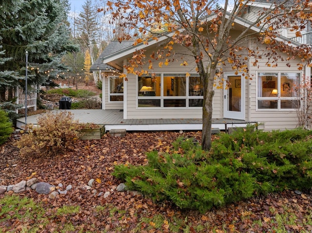 rear view of house with a wooden deck