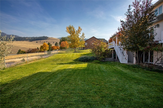 view of yard with a rural view