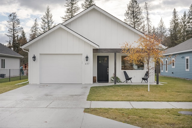 view of front facade with a garage and a front lawn