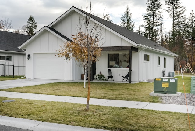 view of front of house with a garage and a front yard