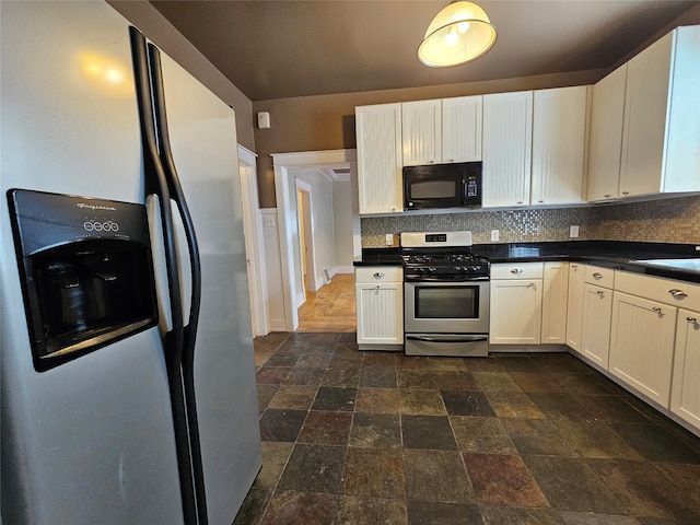 kitchen featuring white cabinetry, decorative backsplash, and stainless steel appliances