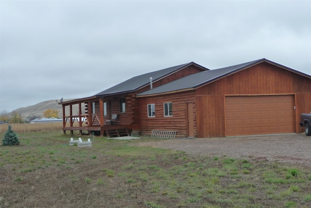 view of front of house with a mountain view and a garage