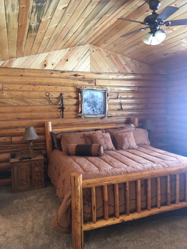 bedroom with dark colored carpet, lofted ceiling, ceiling fan, and wooden ceiling