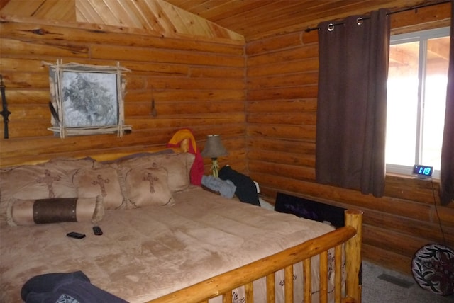 bedroom featuring lofted ceiling and wood ceiling