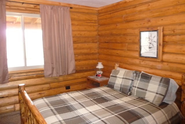 unfurnished bedroom with log walls