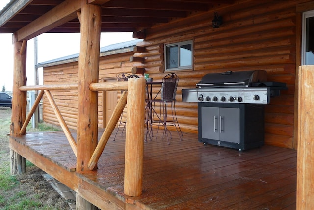 wooden terrace with area for grilling