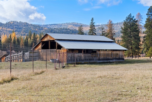 view of outbuilding with a mountain view