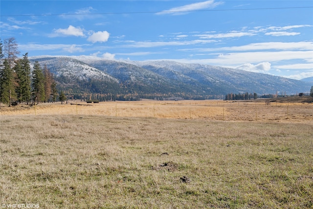 mountain view featuring a rural view