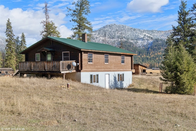 back of house featuring a mountain view