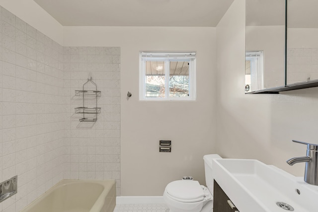 bathroom featuring tile patterned floors, vanity, and toilet