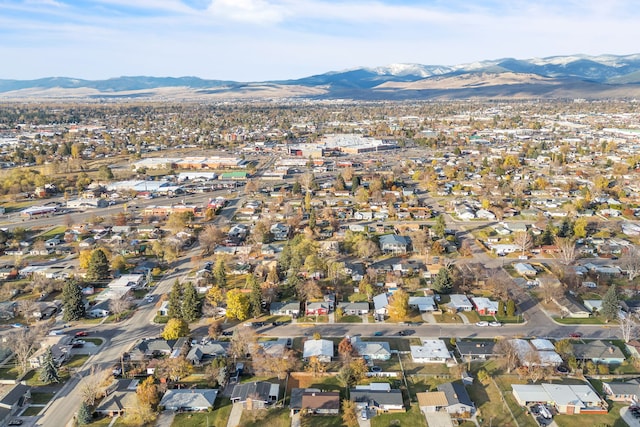 birds eye view of property featuring a mountain view