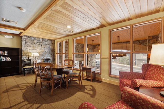 dining area featuring a fireplace, wood ceiling, and vaulted ceiling