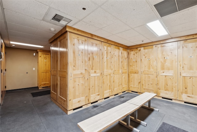 interior space with a paneled ceiling