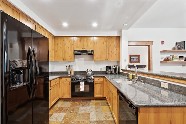 kitchen featuring kitchen peninsula, black appliances, sink, and dark stone countertops