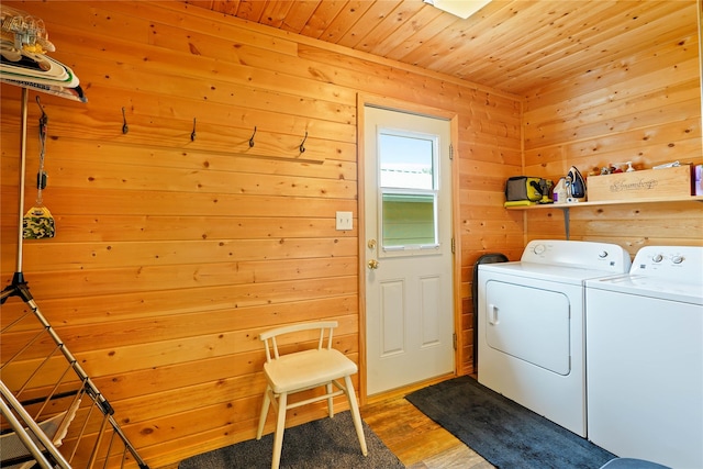 310 N Walnut St, Townsend, MT 59644 - laundry area with washer and clothes dryer, wooden ceiling, wood finished floors, and wood walls