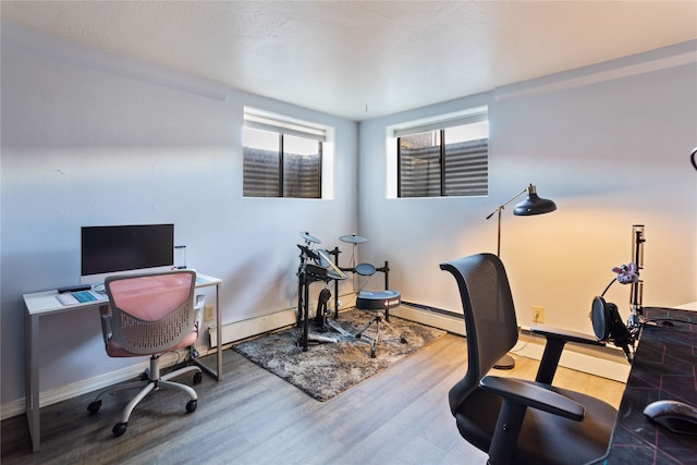 office featuring a baseboard radiator and hardwood / wood-style floors