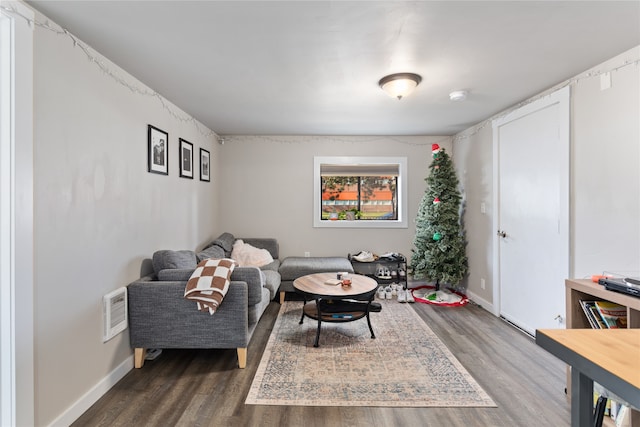 sitting room with wood-type flooring