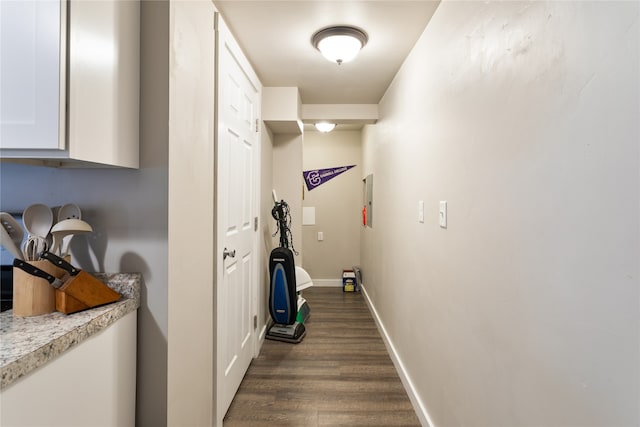 corridor featuring dark wood-type flooring