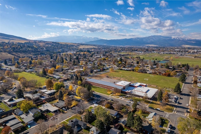 birds eye view of property with a mountain view